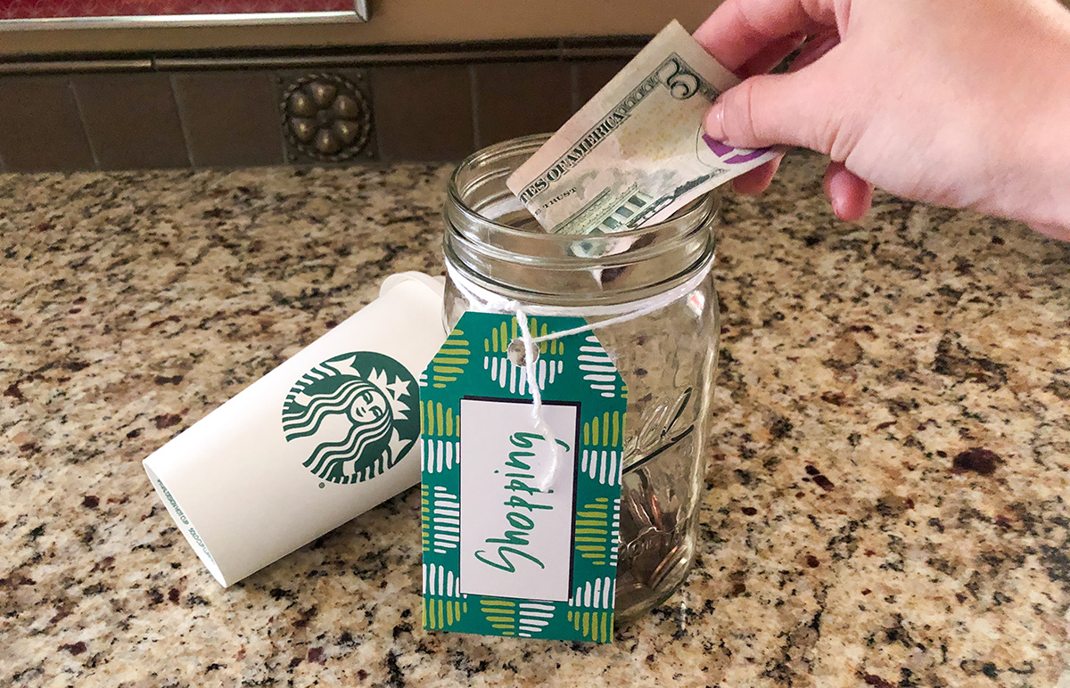 Putting $5 into money jar