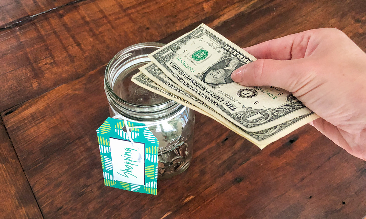 Adding $3 to money jar